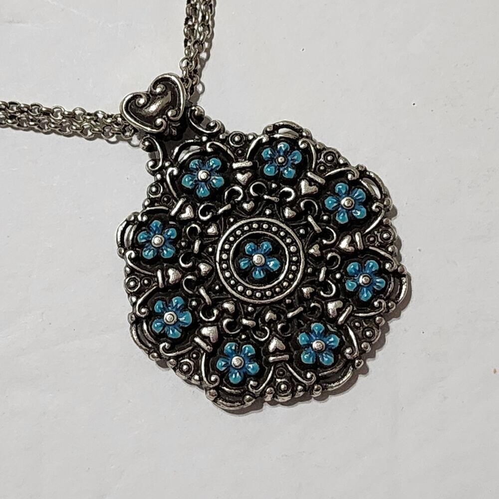 Brighton Lucia Pendant Necklace is silver tone metal and turquoise enamel flower